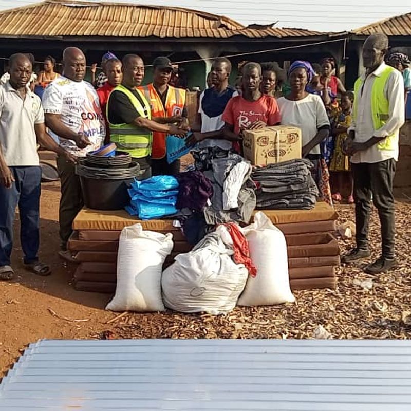 Geoffrey Kini donates relief items to support disabled fire victim